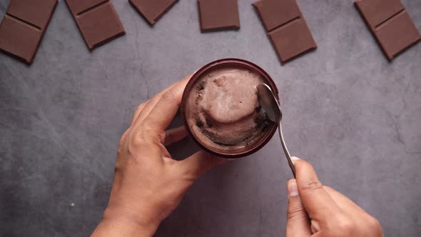 Top View of Man Eating Chocolate Flavor Ice Cream in a Container