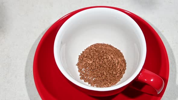 Pour instant freeze dried coffee crystals to cup