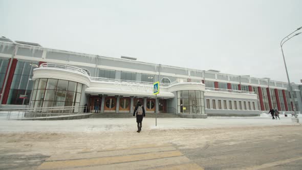 A Passenger Goes to the Train Station in Winter