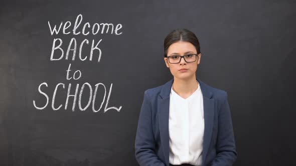 Unhappy Disappointed Teacher Standing Near Blackboard Welcome Back to School