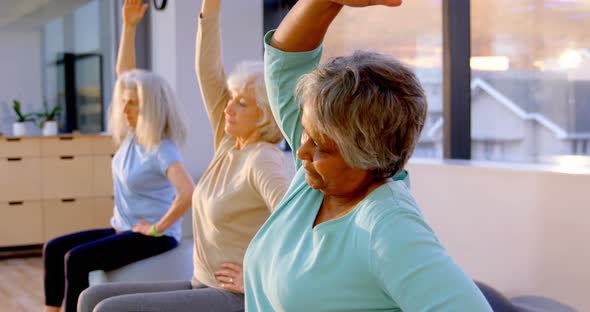 Senior women performing yoga 4k