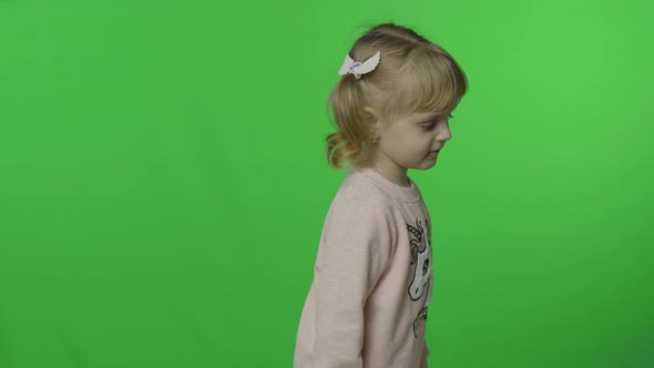 Girl in Unicorn Sweatshirt Make Faces and Smile