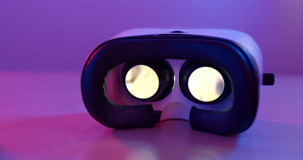 VR playing video inside with pink and purple light