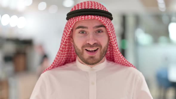 Portrait of Excited Arab Businessman Celebrating Success