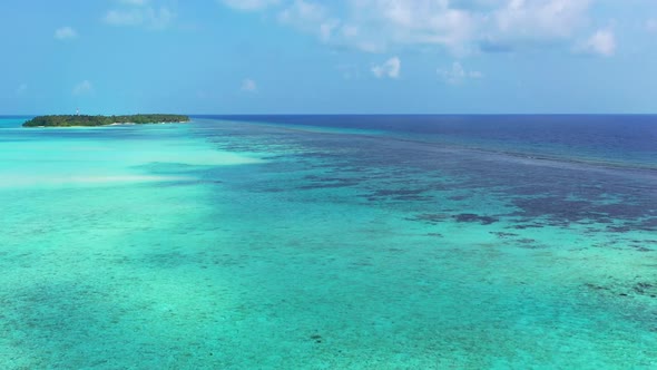 Aerial top down sky of marine lagoon beach break by blue ocean and white sand background of a picnic