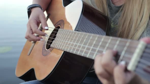 Girl Playing on the Guitar