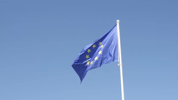 Recognizable EU flag slow motion waving against blue sky 1920X1080 HD footage - Famous European Unio