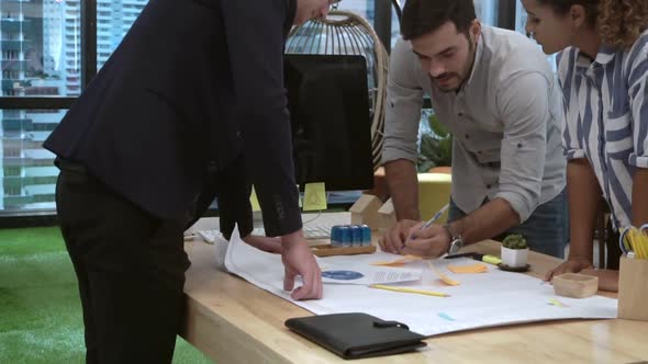 Creative Business People Group Having Conversation at Office Desk in Workplace