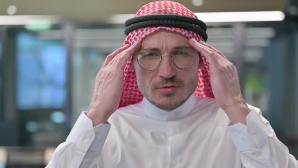 Middle Aged Arab Man having Headache