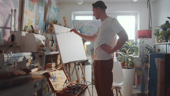 Artist Drawing Picture on Canvas in Art Studio