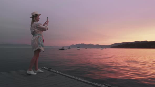 30s American Tourist Photographer Woman Shooting Scenic Lake Tahoe Sunset Views