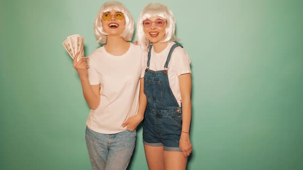 Two carefree young girls going crazy in studio