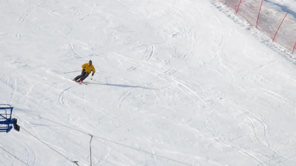 Man Skier Running Downhill