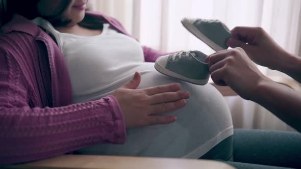 Pregnant Couple Feels Love and Relax at Home