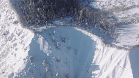 Aerial Footage of Extreme Ski Slope Along a Mountain Covered with Snow