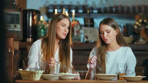 Female Friends Having Lunch Together at the Cafe