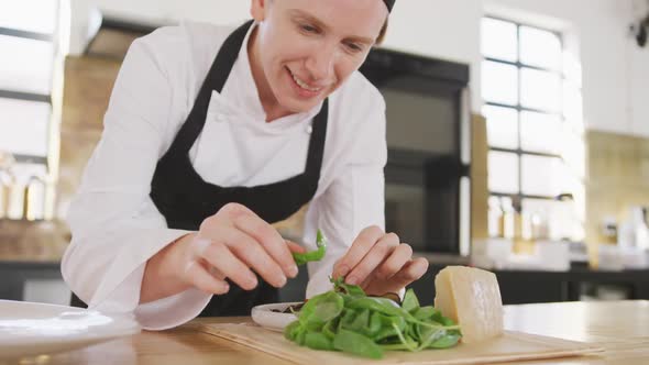 Chef adding some fresh salad