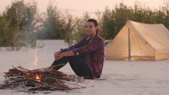 Tourist Woman in the Camp Near Campfire