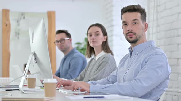 Portrait of Startup Team Looking at the Camera in Office