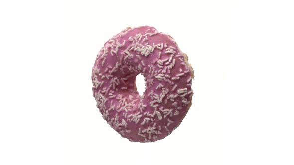 Tasty American Donut Rotate on White Isolated Background. Fresh Sweet Cake of Pink Color with Sugar