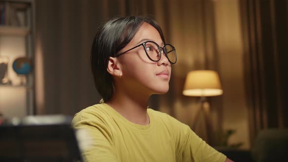 Close Up Asian Girl Using Desktop Computer In Home At Night