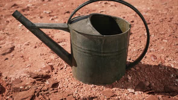 Beverage Can in Sand and Rocks Desert alt