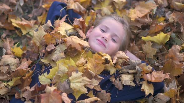 Happy Child in a Beautiful Autumn Park. Top view.