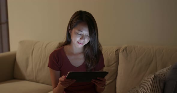 Woman use of the tablet at home