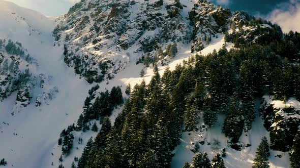 Flying down near Snowy Mountain Hill in Winter