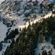 Flying down near Snowy Mountain Hill in Winter - VideoHive Item for Sale