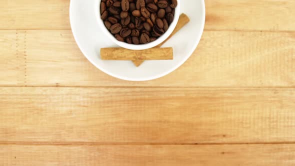 Close-up of coffee cup with cinnamon sticks