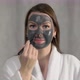 Young Woman Takes Care of Skin of Face - VideoHive Item for Sale
