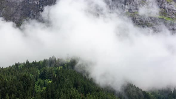 Dynamic timelapse of low clouds at top station of pfingstegg cable car in grindelwald