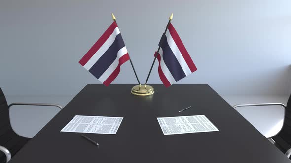 Flags of Thailand and Papers on the Table