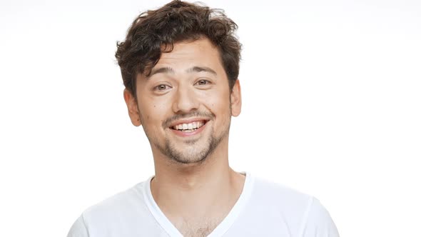 Young Handsome Man Smiling Showing Okay Looking at Camera Over White Background