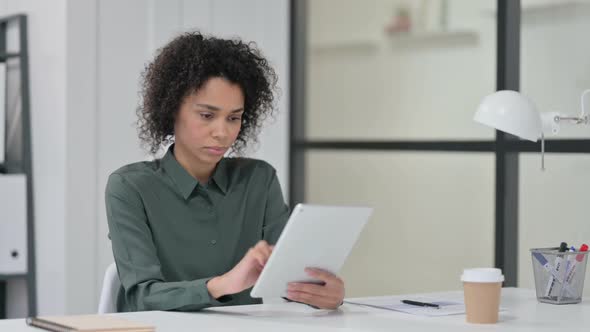 Disappointed African Woman Reacting to Loss on Tablet