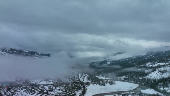 Clouds High in the Winter Mountains Aerial View 4 K