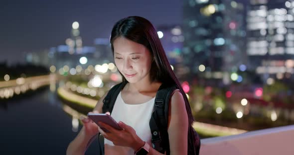 Woman use of cellphone in the evening