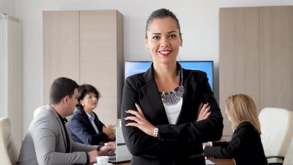 Confident and Beautiful Businesswoman Smiling To the Camera