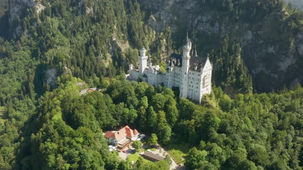 Fly Around Neuschwanstein Castle at Green Landscape, Bavaria, Germany