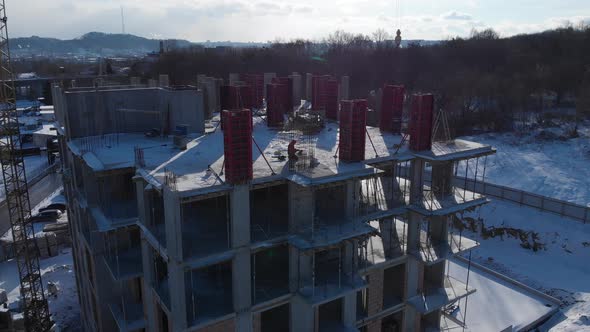 Aerial shot of building residental house on construction site.