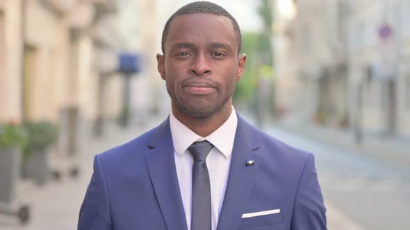 Outdoor Serious African Businessman Looking at the Camera