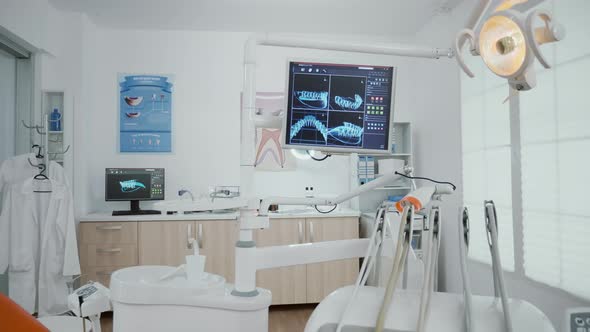 Interior of Empty Stomatology Orthodontist Office Room Equipped with x Ray on Monitors