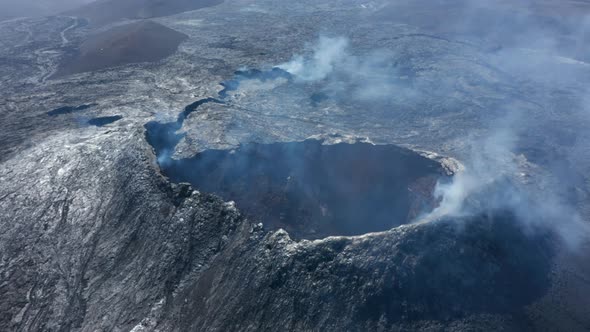 Otherworldly Aerial Drone View of Smoky Volcanic Lake Lava Landscape Drone Flying Backwards Reveals