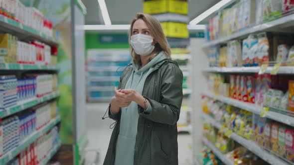 Woman in Protective Mask at the Supermarket