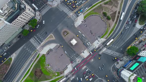 Aerial Drone scene of Obelisk in Buenos Aires, Argentina. 9 de Julio main Avenue.Traffic and people