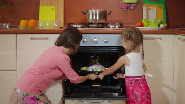 Young Mother Teaching Cute Daughter Cooking in Kitchen, Happy Family Small Child Girl Helping Mom