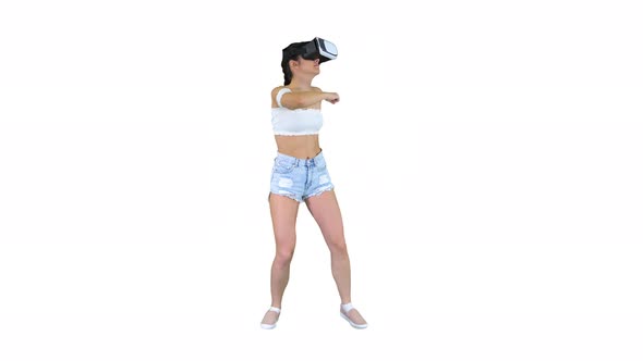 Cute Girl Dancing While She Has Her VR on Dancing Time on White Background