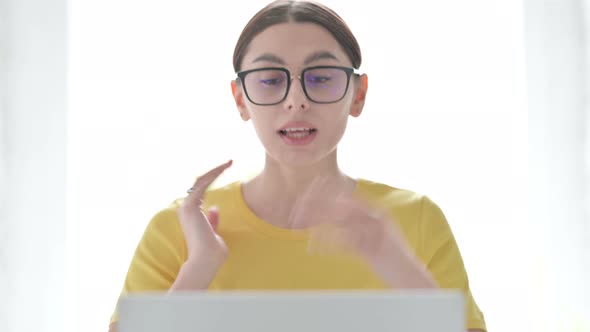 Portrait of Woman Talking on Video Call on Laptop