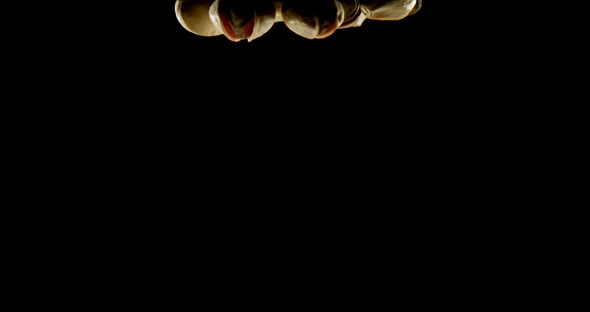 Pistachios falling on black background 4k